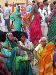 Women in colorful saris on the ghats of Varanasi, India